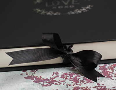 Matted prints in a folio box